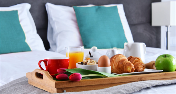 A breakfast tray on a bed