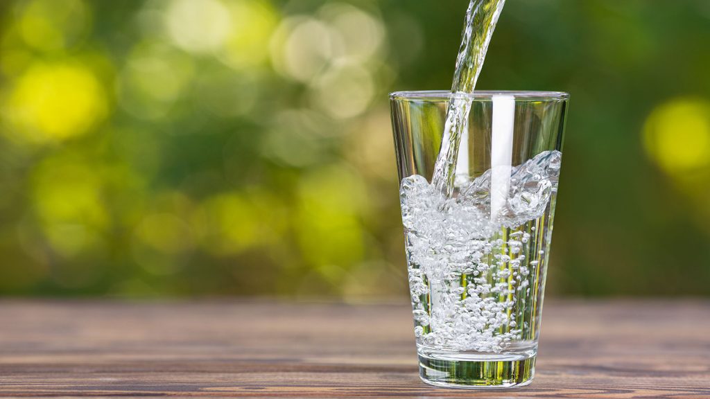 Water pouring into a glass