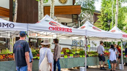 Farmer's market in Colorado with food vendors local stall for fruit.