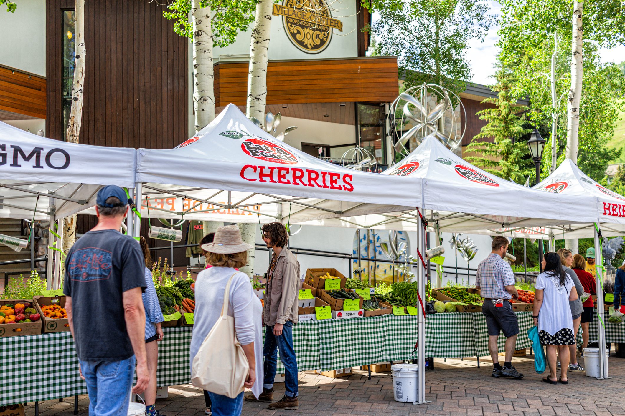 Farmer's market in Colorado with food vendors local stall for fruit.